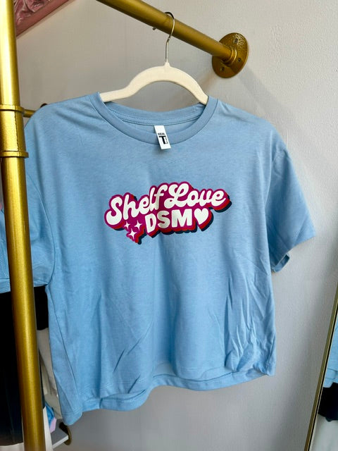 Baby Blue Shelf Love DSM Cropped Logo Tee